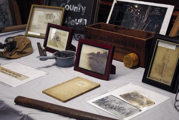 HISTORIC PHOTOGRAPHS, mining equipment and other artifacts on display at the Ray County Museum highlight the county’s coal-mining heritage and the families connected to the industry. SHARON DONAT | Staff