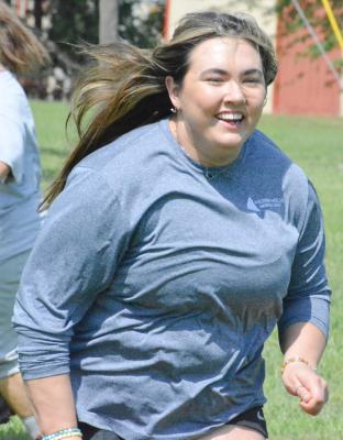 BROOKE WATSON, Hardin-Central’s new assistant high school softball coach, runs Aug. 18 with the Bulldogs at the Hardin American Legion and Auxiliary baseball and softball fields. SHAWN RONEY | Staff