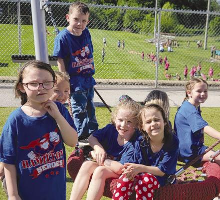 TAKING A BREAK on the Dear Elementary playground’s saucer swing are Elena Graham (from left), Charli Dunwoodie, Nora Higgins, Kylea Covey, Wyatt Rosenbalm and Sutton Hyder. DIANA SHULL | Staff
