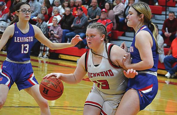 RICHMOND SENIOR Lexi Bokarae appears to draw contact while dribbling during the Spartans’ 49-22 win Feb. 11 over visiting Lexington. SHAWN RONEY | Staff