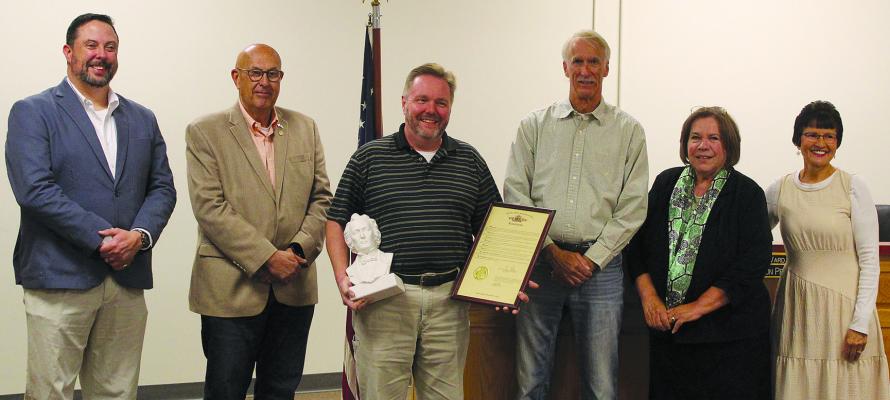 JIMMY CARTER (from left), State Representative Terry Thompson, Rob Swafford, John Letzig, Shelia Bridges and Princess Coughlin celebrate this year’s David Whitmer award winner. SHARON DONAT | Staff