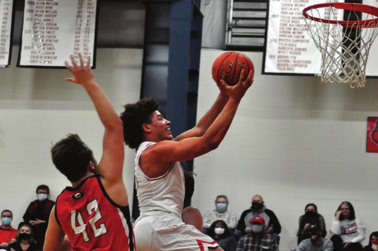 KEYSHAUN ELLIOTT attempts a layup for Richmond against Gallatin. SHAWN RONEY | Staff