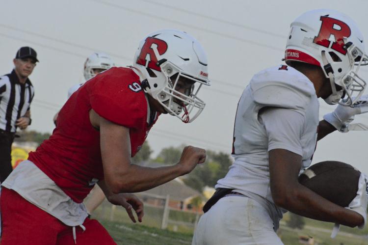 BRICE DOME (right), shown eluding Mattox McCloud, is among Richmond’s skill position players with high potential, according to coach Nick Persell. SHAWN RONEY | Staff
