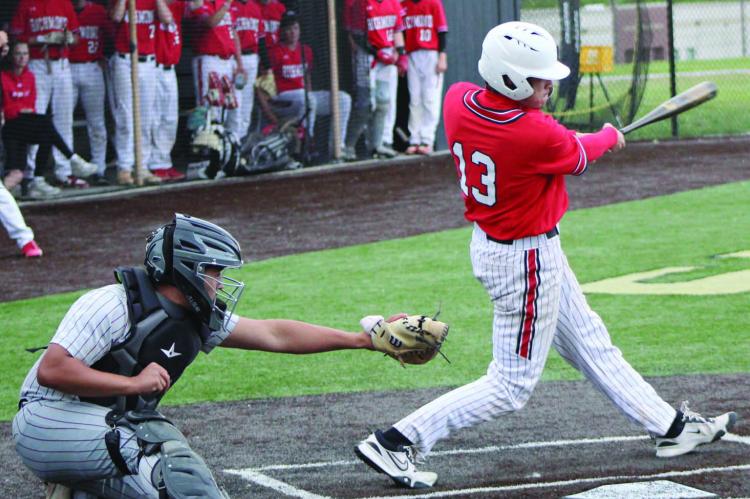 NOAH STEVENS-BREHM (right) swings at a pitch during Richmond’s 8-1 loss to Benton of St. Joseph in Class 4 District 15 play. At press time, Benton was preparing to play Excelsior Springs Thursday for the district championship. Richmond finished its season 7-14 with the defeat in the single-elimination varsity baseball tournament. MIRANDA JAMISON | Staff