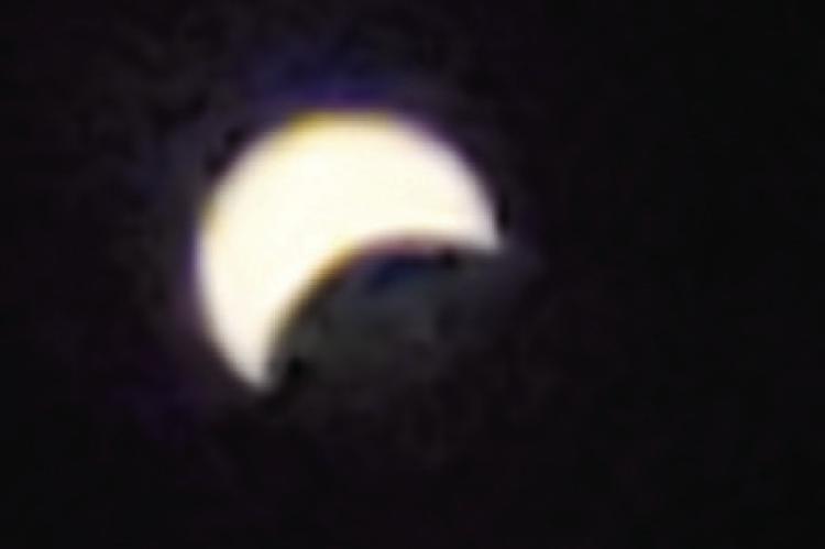 Orrick students watch the moon cover the sun during eclipse
