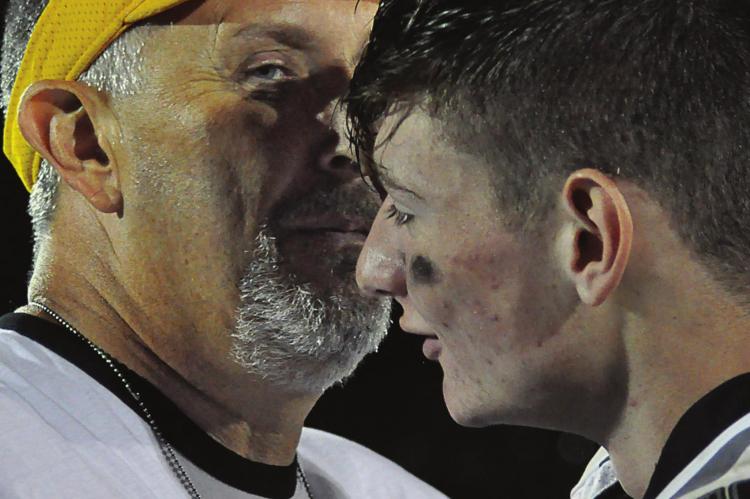 ORRICK COACH Kirk Thacker, left, reunites with Norborne Hardin-Central’s Kobe Gibson after Orrick’s 80-34 Oct. 8 home victory over NHC, a win that Thacker finds unpleasant as NHC’s former varsity 8-man football coach. SHAWN RONEY | Staff