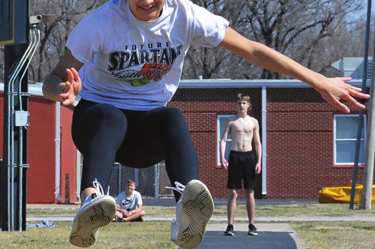 ORRICK FIRST-YEAR high schooler Anela Fletcher, who plans to run the hurdles this season, gets in some jumping, too, March 15 at the school track. SHAWN RONEY | Staff