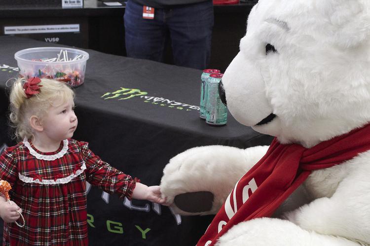 FIONA GOOD shakes hands with the Polar Bear at Harps. SHARON DONAT | Staff