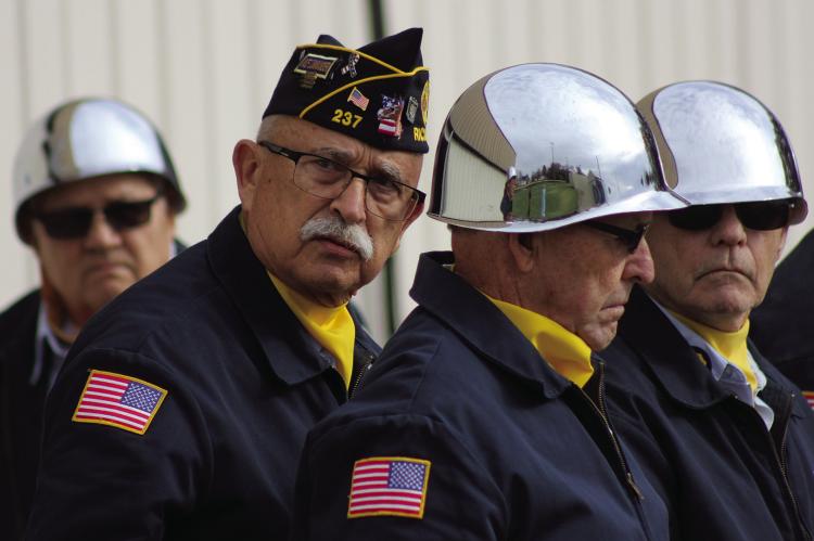 BILL CAIN (from left), Jim Edens, Brian Nichols and Jim Richardson of the American Legion Post #237 participate in their Veteran’s Day Program. SOPHIA BALES | Staff