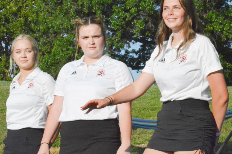 MEET THE RICHMOND girls golf team, from left, Zalie Gregory, Kennedy Wrisinger and Bree Travillion, who appear Aug. 25 at the Branded Outdoor Theatre during the Meet the Spartans fall sports kickoff event. SHAWN RONEY | Staff
