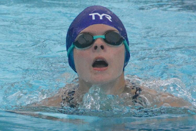 GRACE BOZARTH swims the breaststroke while competing for the Richmond Dolphin Swim Team in meet competition June 25 at Southview Pool. SHAWN RONEY | Staff