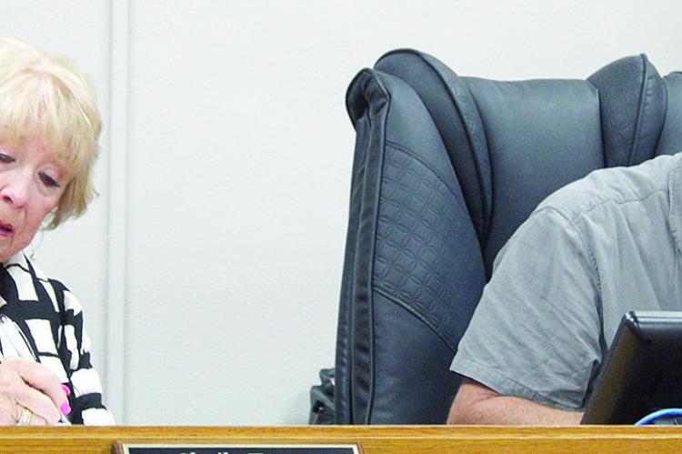 RAY COUNTY COMMISSIONERS respond to questions concerning the accuracy of meeting minutes. MIRANDA JAMISON | Staff