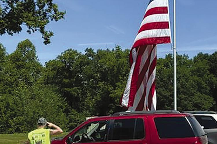 WITH A SALUTE, the American flag is flown for Flag Day. JOSHUA BRUNGARDT | Staff