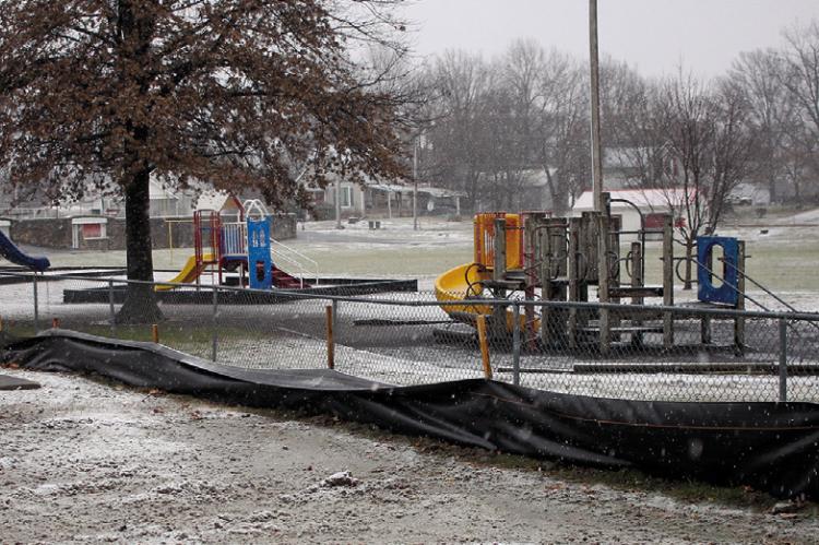 BLACK TARP was placed to keep debris away from areas the youth play at Dear Elementary. SOPHIA BALES | Staff