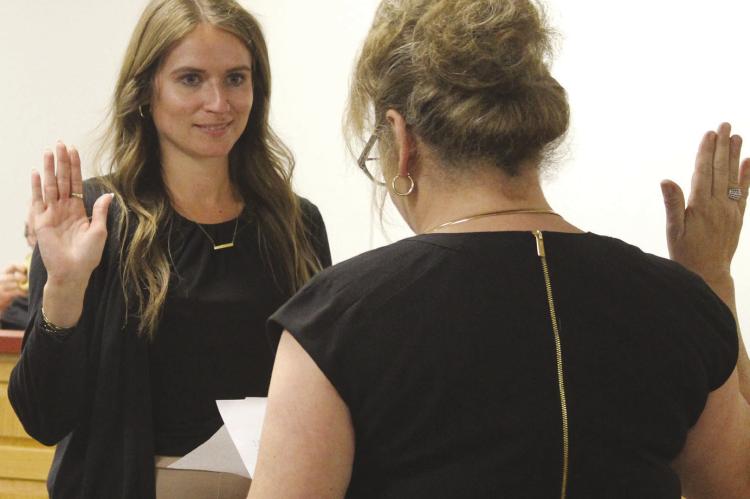 NEW RICHMOND CITY CLERK Saige Mason (left) is sworn in by City Administrator Tonya William. SHARON DONAT | Staff