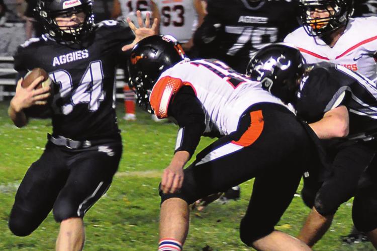 KELTON GORDON, a Hardin-Central junior, gets the call to carry for the Aggies during Norborne Hardin-Central’s 64-30 loss to Northwest of Hughesville/Sacred Heart of Sedalia Oct. 15 at Hardin-Central. The Aggies rely on Gordon to help run the football during their 42-18 season-ending loss to Northwest/Sacred Heart Nov. 5 at Hughesville, too. SHAWN RONEY | Staff