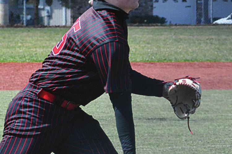 EASY DOES IT ... Richmond senior pitcher Lucas Rodenberg helps keep Southern Boone in check for a while by flipping to first base for a ground out March 26 in the Odessa Tournament. SHAWN RONEY | Staff