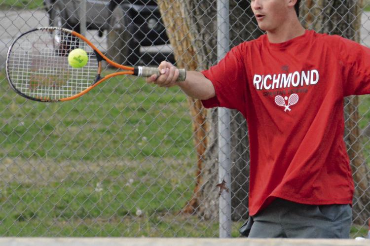 JAZSPHER ULLEBERG attempts a forehand shot during Richmond’s varsity boys tennis dual with Lafayette County of Higginsville. SHAWN RONEY | Staff