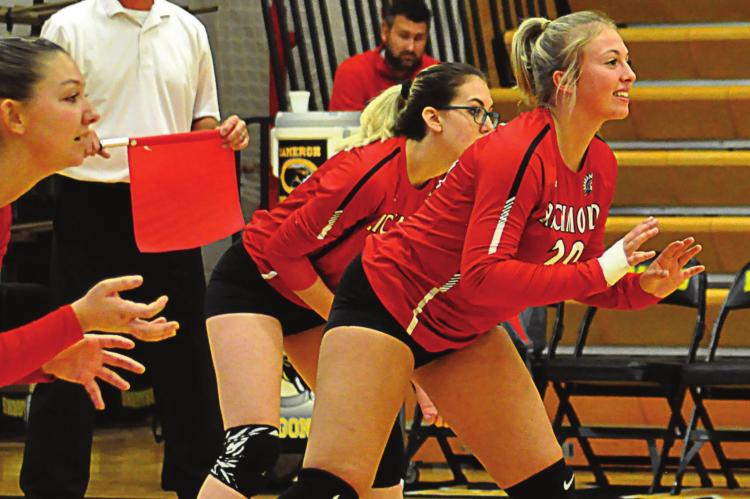 FROM LEFT, Kyli Thornberry, Laney Moyer and Destiny Kincanon are ready to receive a first-set serve on the back row during Richmond’s Oct. 23, Class 3 District 16 semifinal with Cameron at Cameron. SHAWN RONEY | Staff