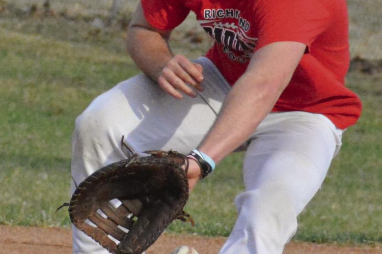 JACOB LIEBERKNECHT fields a ground ball at first base as he and his Richmond teammates prep for baseball season. SHAWN RONEY | Staff