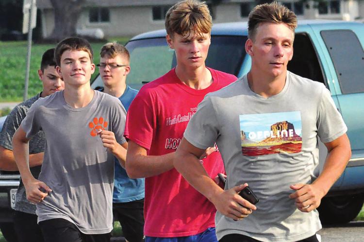 IN AUGUST, Mason Freece leads the Hardin-Central cross country team on a morning run. In November, he is leading the Bulldogs to the Class 1 state meet at Columbia. SHAWN RONEY | Staff