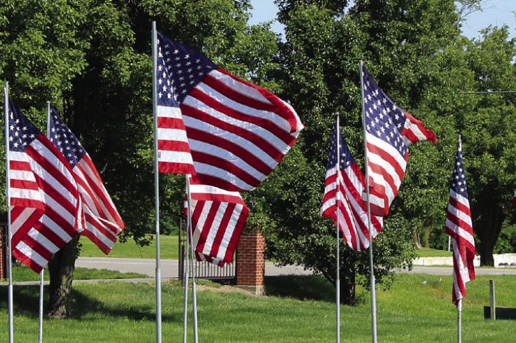 FLAGS WAVE IN the wind in memory of service men and women who lost their lives in service to our country. SHARON DONAT | Staff