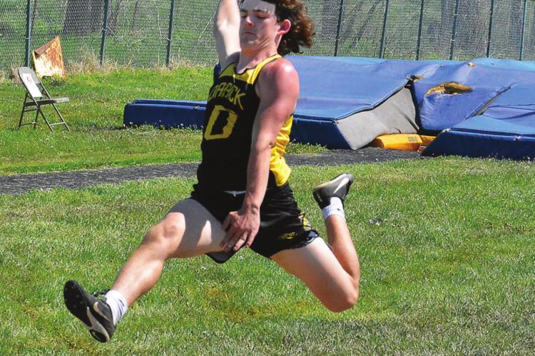 SOPHOMORE Jaxon Miller attempts the long jump May 7 late in the Class 1 District 6 track and field championships on the Midway School District campus in Cleveland. He qualifies for sectional competition this weekend. SHAWN RONEY | Staff