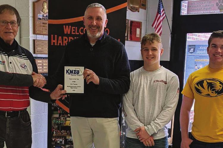 KIRK THACKER displays his Dream Team 8-Man Football Coach of the Year award from Joe Aull of KMZU. Others, from left, are two of his Norborne Hardin-Central Aggies, Mason McCaulley and Nate Hawkins. SUBMITTED PHOTO