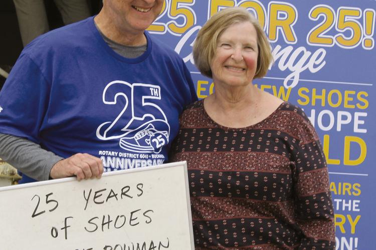 ROTARY INTERNATIONAL President-nominee Larry Lunsford (left) recognizes Richmond Rotary Club member and longtime Shoes for Orphan Souls leader Margie Bowman for 25 years of involvement in the effort. SHARON DONAT | Staff