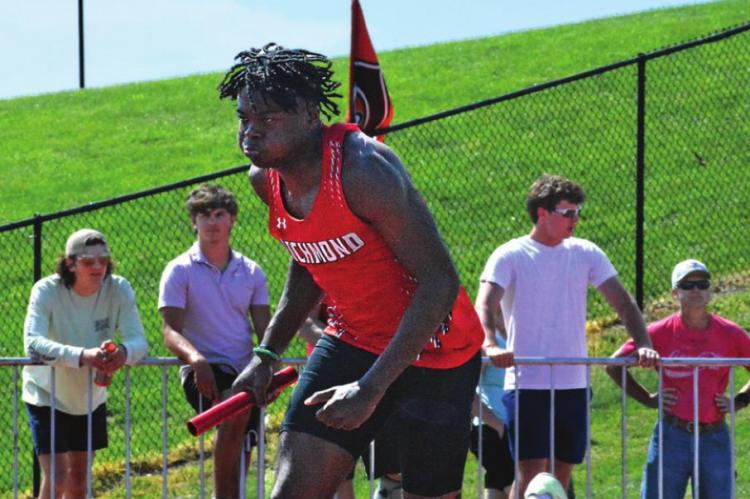 JACOBY JOHNSON runs his leg of the 1,600-meter relay May 14 at district competition at Chillicothe. He and his teammates place third. SHAWN RONEY | Staff
