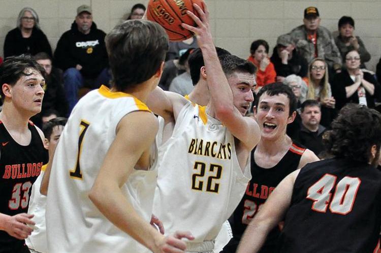 DYLAN COMSTOCK has control of the basketball for the Bearcats Friday night during their 55-43 courtwarming win over Hardin-Central.