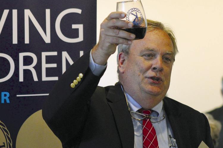 KIWANIAN GOVERNOR Paul Sherman toasts the next 100 years for the Richmond Kiwanis Club. SOPHIA BALES | Staff