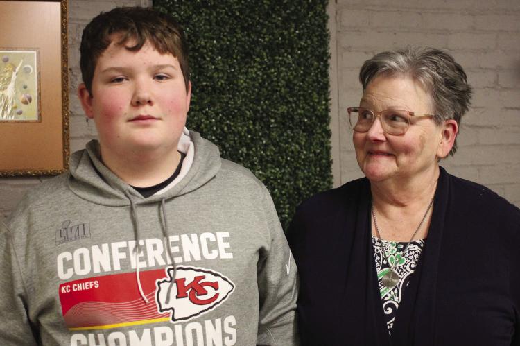 CASH ADAMS, 13, and his grandmother Mary Adams (right) appreciate the community’s support with his injury after the Chiefs rally. SOPHIA BALES | Staff