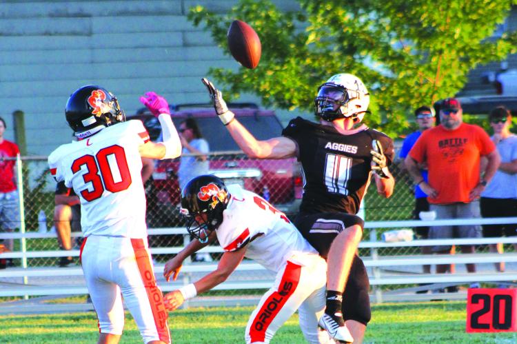 KOBE GIBSON, a Norborne senior, keeps his eyes on the football as he looks to haul in a first-half pass for Norborne Hardin-Central during the first half of the Aggies’ 70-28 rout of Concordia Sept. 2 at Hardin-Central. SOPHIA BALES | Staff