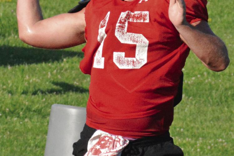 SHAWN RONEY | Staff QUARTERBACK JACOB LIEBERKNECHT sets to pass as Richmond begins its high school football camp sessions.