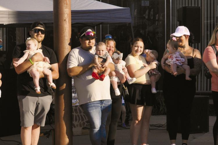FAMILIES EAGERLY await the results of the Mr. and Mrs. Mushroom Contest. KAITLYN RIDDLE | Staff