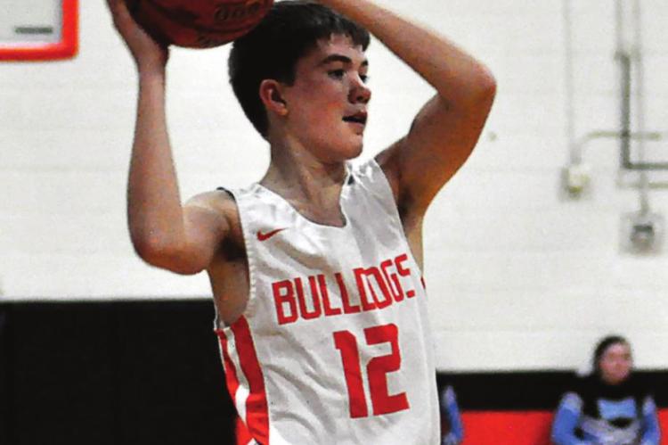 FRESHMAN DREW HAWKINS looks to pass Monday for Hardin-Central. SHAWN RONEY | Staff