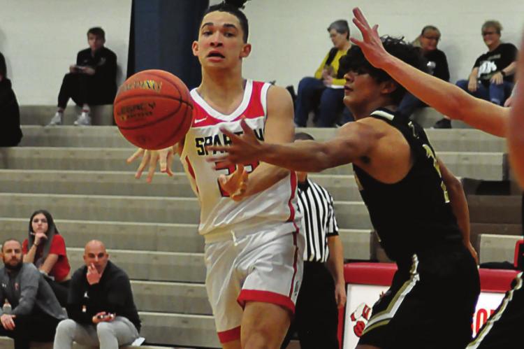 COMING OFF the bench, Donivin Williams passes during the first half of Richmond’s 77-21 win Monday over Trenton at Lawson in tournament play. SHAWN RONEY | Staff