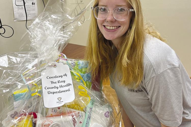 ALISHA MILLIGAN won a basket of baby goodies from the Richmond Bridge of Hope’s “Community Baby Shower” event. The shower was recently coordinated by Richmond’s Bridge of Hope Program and Executive Director Connie Taylor and held at Ray County Library’s Community Room. Pregnant mothers, those interested in pregnancy education, and community members had the opportunity to join in the event. SOPHIA BALES | Staff