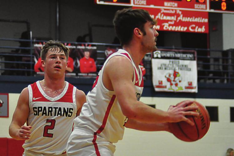 SHAWN RONEY | Staff COLLIN CROMLEY looks set to shoot as teammate Layne Cavanah watches.