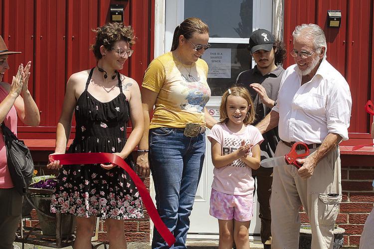 COMMUNITY MEMBERS CELEBRATE the official opening of Richmond Regenerative Agriculture’s donkey farm bed and breakfast, a working farm offering overnight accommodations and hands-on agricultural experiences. SHARON DONAT | Staff
