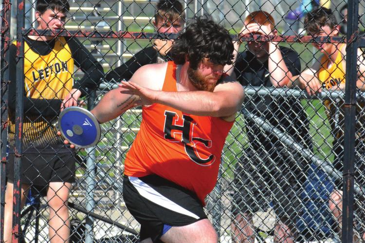 HARDIN-CENTRAL junior J.W. Doyle rotates as he attempts a discus throw May 7 during the Class 1 District 6 track and field championships on the Midway School District Campus in Cleveland. SHAWN RONEY | Staff
