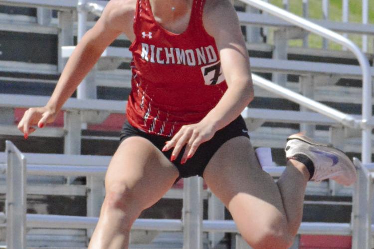 KAYLEE KING goes airborne as she heads down the home straightaway in the girls 300-meter low hurdles at the Class 3 District 8 meet. SHAWN RONEY | Staff