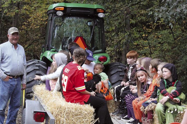 FAMILIES TAKE part in a hayride during the festivities. MIRANDA JAMISON | Staff