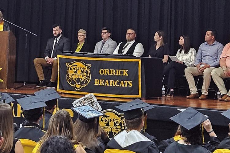 ORRICK HIGH SCHOOL graduates listen as speakers reflect on their achievements and offer advice for the future. MIRANDA JAMISON | Staff