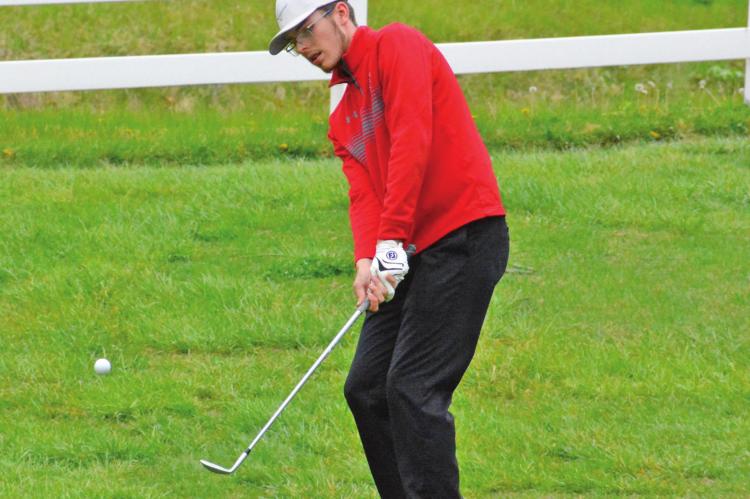 RICHMOND SENIOR Aiden Bowman chips the ball onto the green late in his round at the Richmond Invitational April 29 at Shirkey Golf Course in Richmond. Bowman cracks the top 20 out of a field 106 golfers. SHAWN RONEY | Staff