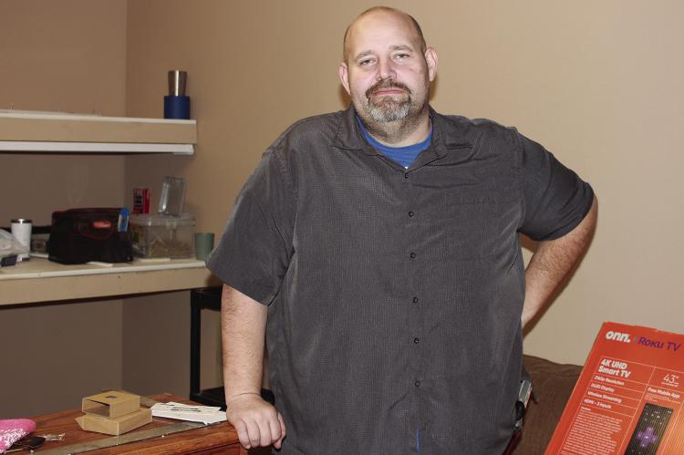 RAY COUNTY SHERIFF Scott Childers stands in the newly-built office of Detective Josh Hammer. Hamner needed a forensic space of his own for his work with the Ray County Internet Crimes Against Children Task Force, said Childers. SOPHIA BALES | Staff