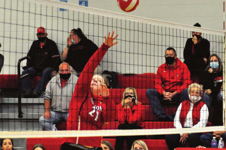 SENIOR KRISTEN JAGGARS tips a shot over the net for the Spartans during their third-place match with Brookfield Oct. 3 at the Carrollton Tournament. SHAWN RONEY | Staff