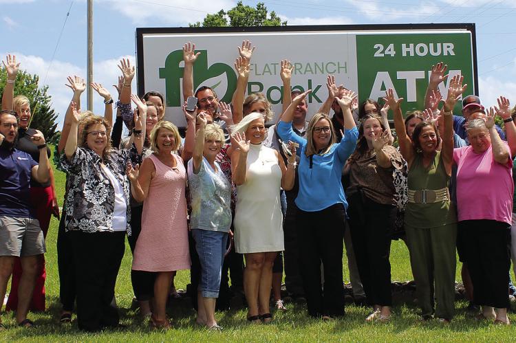 FLAT BRANCH BANK celebrates after the ribbon cutting hosted by the chamber. SHARON DONAT | Staff