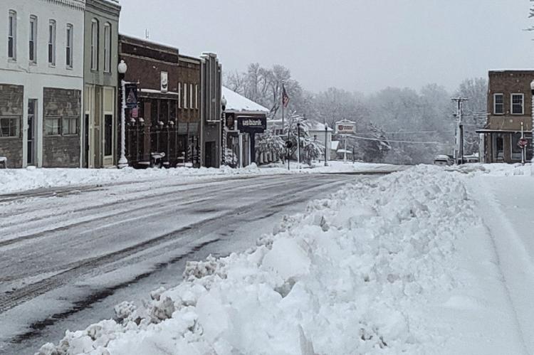 NORTH MAIN STREET has been cleared, leaving parking areas piled with snow. SHARON DONAT | Staff